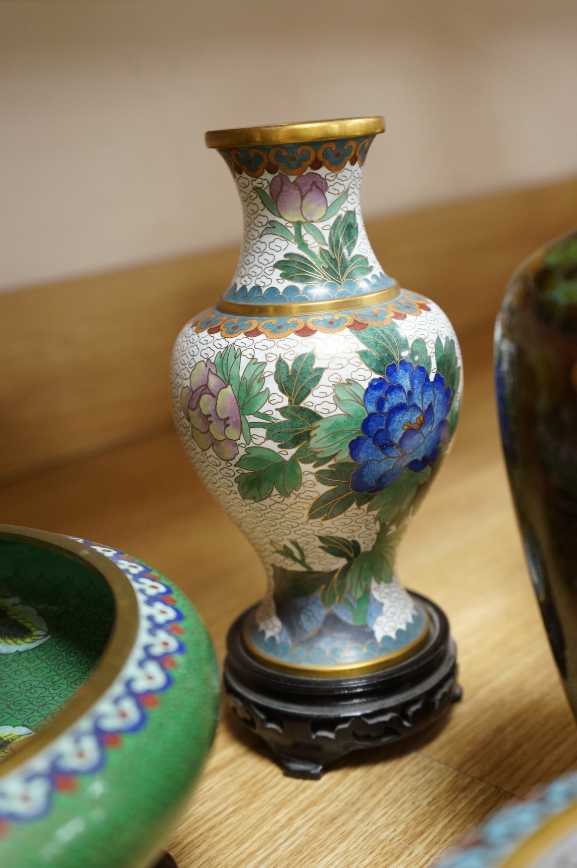 A plique a jour enamel tea bowl together with a collection of cloisonné enamel vases, bowls etc., tallest 26cm